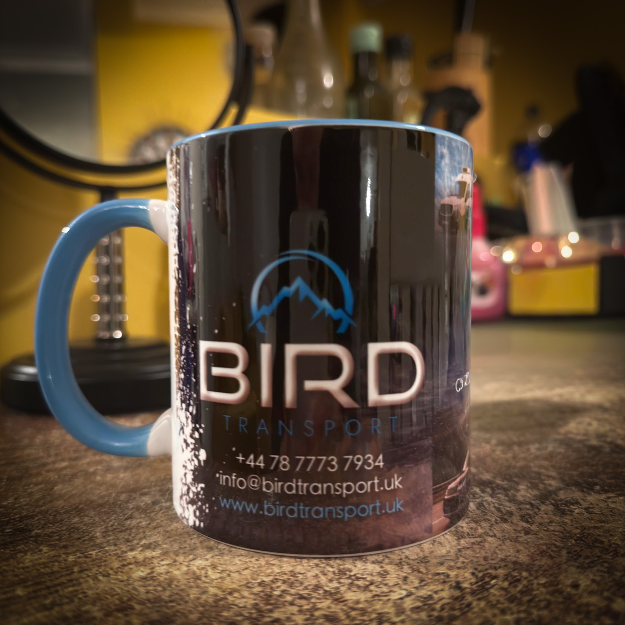 Corporate mug with Bird Transport logo printed for transport company in Oxford
